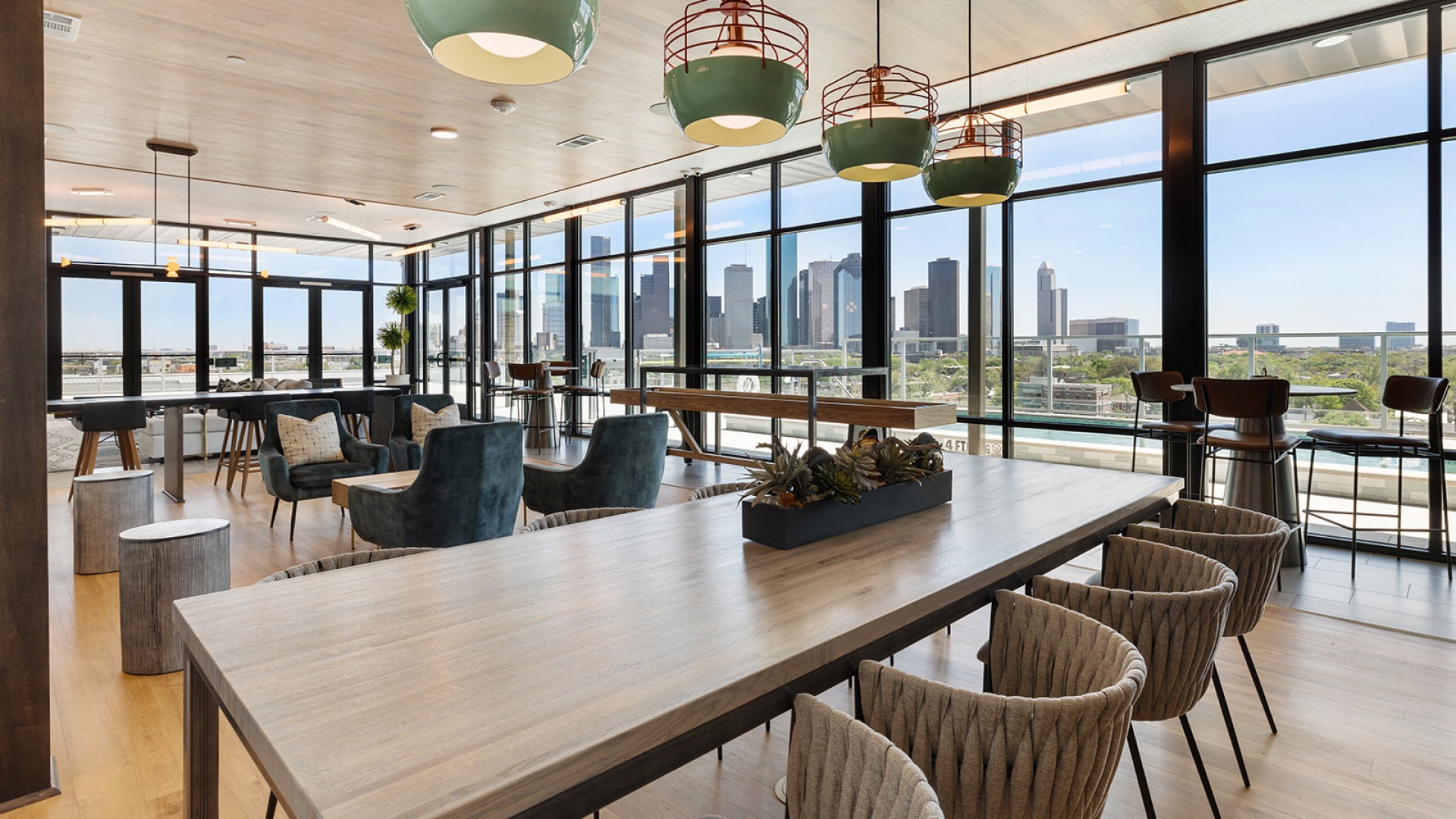 Starry Night Sky Lounge at our apartments in Houston, TX, featuring ample seating and a view of the city skyline.